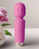 Peony Pink Rechargeable Mini Wand Massager displayed with floral background, showcasing its elegant design and compact size.