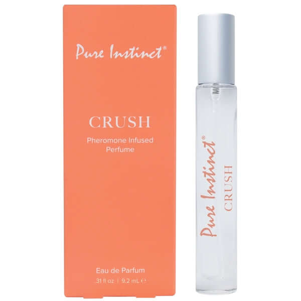 Pure Instinct Pheromone Infused Eau de Parfum Crush .31 fl oz / 9.2 ml with orange packaging and sleek bottle