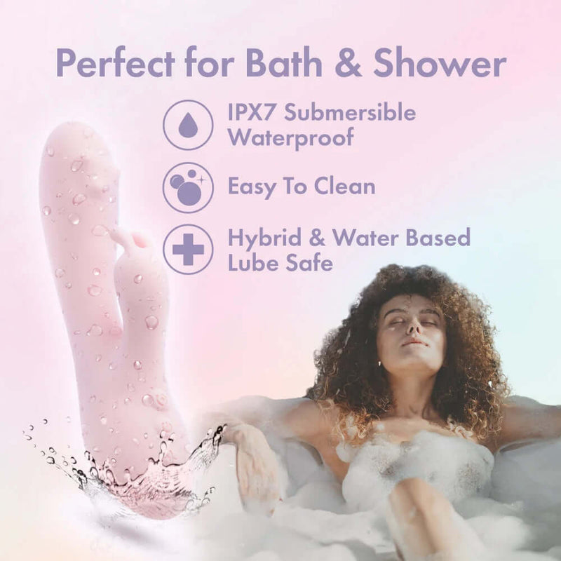 Waterproof pink rabbit massager with vibration modes floating in bathwater, featuring IPX7, easy to clean, and lube safe symbols.