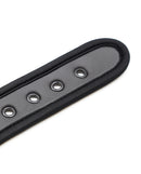 Close-up of the Plesur Neoprene Puppy Collar Black showcasing its soft neoprene material and secure D-ring design.