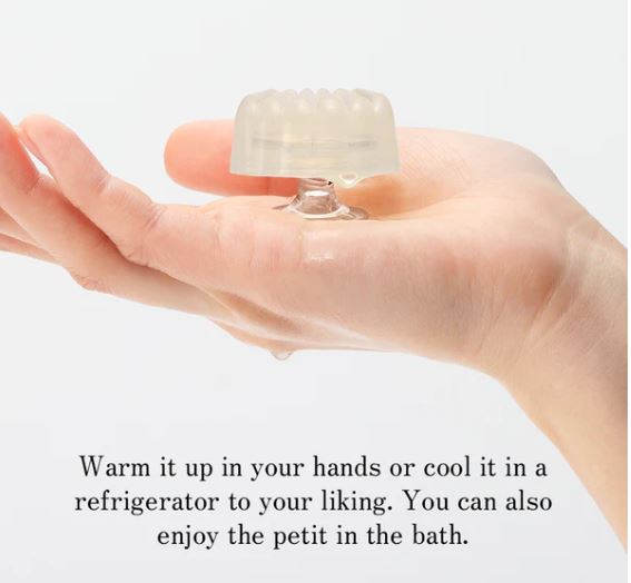 Tenga Iroha Petit Plum held in a hand, highlighting its versatile use in warm or cool temperatures.