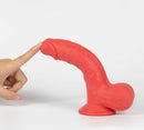 Close-up of Get Lucky Real Skin Mr Ruby 7.5 Inch Dual Layer Dildo Red being touched.