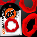 Oxballs Spinner Single Silicone Cock Ring Red displayed on packaging with flexible silicone design and vibrant color.