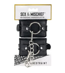 Sex & Mischief Shadow Handcuffs Black Silver displayed with packaging and chain for stylish restraint.