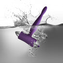 Rocks Off Teazer 7 Speed Purple Vibrating Bullet submerged in water creating splashes.