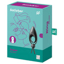 Satisfyer Sniper Vibrating Cock Ring Black packaging displayed against a creative background, showcasing its design and features.