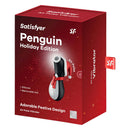 Satisfyer Penguin Holiday Edition Air Pulse Vibrator in festive packaging with silicone and removable hat.