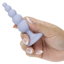 First Time Crystal Beaded Duo Anal Probe Set Purple held in hand showcasing its elegant design and graduated beads.