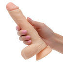 Hand holding the Working Stiff The Vibrating Quarterback Rechargeable Dildo, showcasing its realistic design and features.