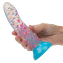 Glow Stick Party Silicone Glow-In-The-Dark Dildo held in hand with colorful confetti design