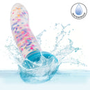 Glow Stick Party Silicone Glow-In-The-Dark Dildo splashing in water, highlighting its waterproof feature.