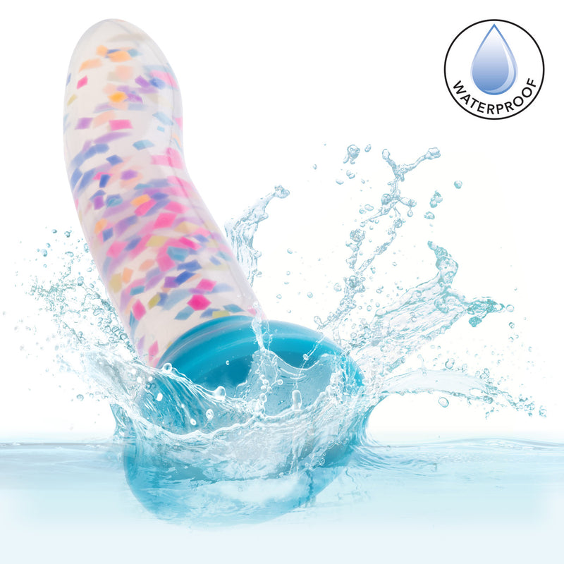 Glow Stick Party Silicone Glow-In-The-Dark Dildo splashing in water, highlighting its waterproof feature.