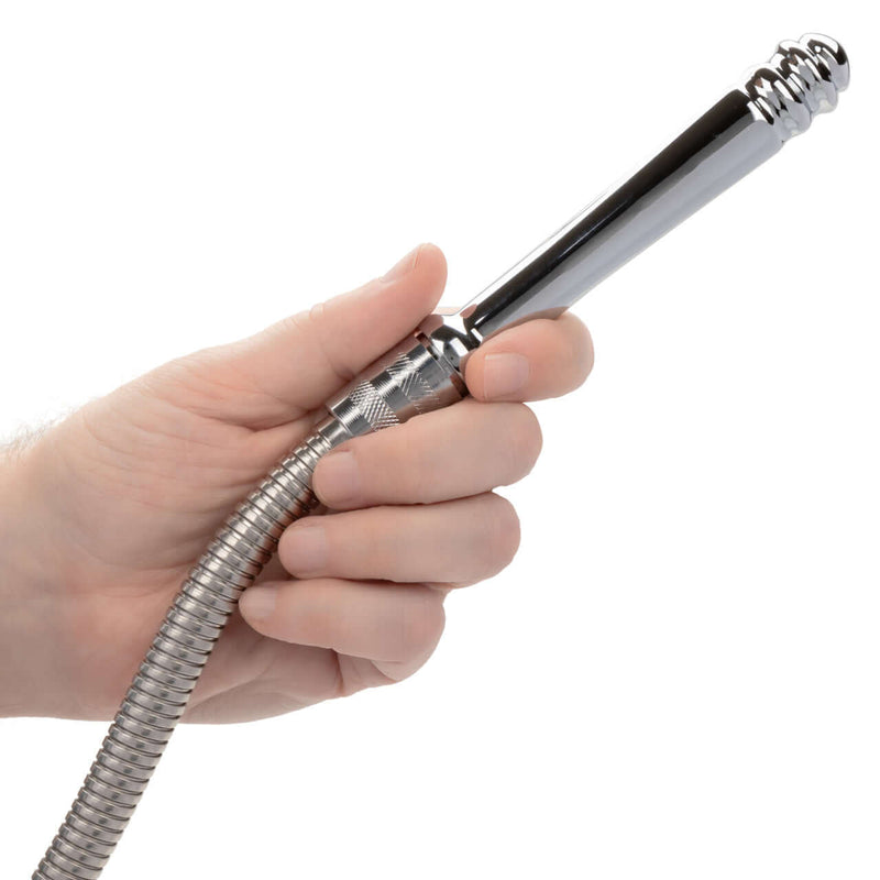Hand holding the Pro Water Works System flexible hose attachment for hygienic cleaning.
