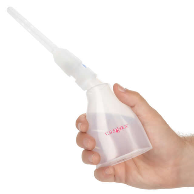 One Way Ultimate Douche Clear by Calexotics held in hand, designed for safe and hygienic cleansing.