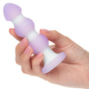 Hand holding Lavender Haze Beaded Probe Vibrating Anal Stimulator with smooth beaded structure and dual-layer silicone.