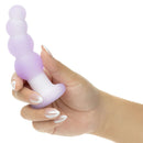 Person holding the Lavender Haze Beaded Curved Rechargeable Probe Purple with a sleek design and textured curves.