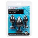 Silicone Gem Anal Kit Black featuring three tapered plugs with gem inlay, packaged elegantly for comfortable exploration.