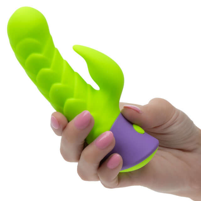 Rave Dragon G Rabbit Vibrator Green held in hand, highlighting its vibrant silicone design and stimulating features.