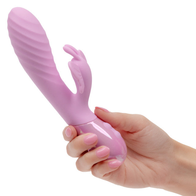 Aura Dual Flutter Rabbit Vibrator in hand showcasing its rippled shaft and butterfly stimulator for dual stimulation.