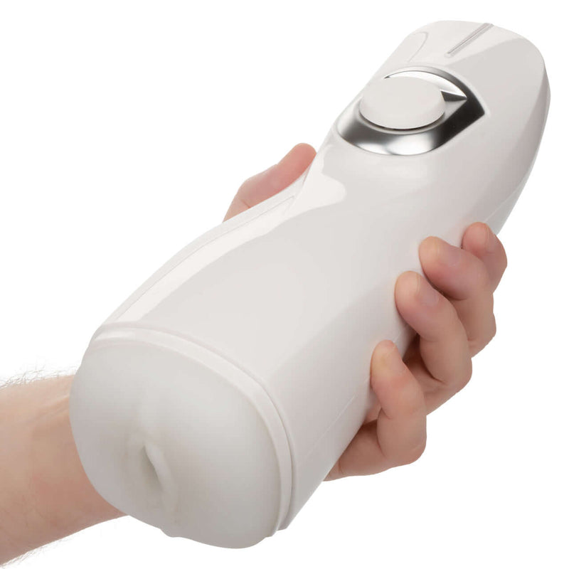 Hand holding Optimum Power® Life-like Pulsar Stroker with rechargeable vibration and suction features.
