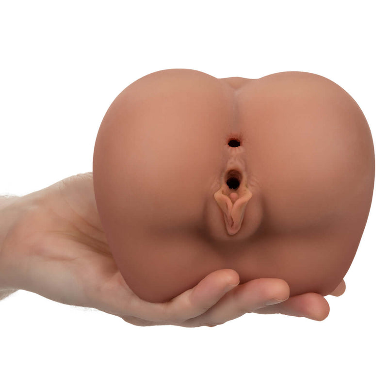 Hand holding the Cheap Thrills The Roller Babe Masturbator showcasing dual entry feature and lifelike Pure Skin® material.
