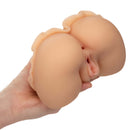 Person holding Cheap Thrills The Peep Show Girl ultra life-like Pure Skin masturbator with dual entry for an authentic experience.