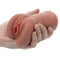 Stroke It Liquid Silicone Juicy Pussy Brown Masturbator held in hand, showcasing realistic design and texture.