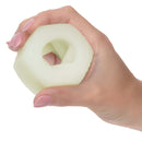 Hand holding Slop Top Nasty Luv textured glow-in-the-dark stroker for enhanced pleasure.