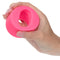 Glow-in-the-dark textured stroker held in hand showing ridged interior for enhanced oral play pleasure.