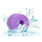Glow-in-the-dark Slop Top Dirty Luv textured stroker in water splash displaying its waterproof feature and vibrant purple color.