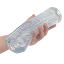 Person holding the Cyclone Dual Ribbed Stroker XL, showcasing its transparent design and dual ribbed texture for enhanced stimulation.