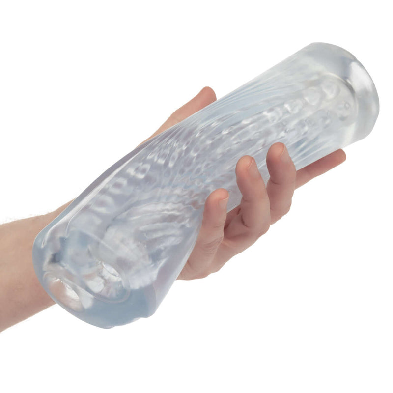 Person holding the Cyclone Dual Ribbed Stroker XL, showcasing its transparent design and dual ribbed texture for enhanced stimulation.