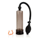 Optimum Series Bullfighter Penis Pump with clear smoky cylinder and manual pump system for enhanced firmness.
