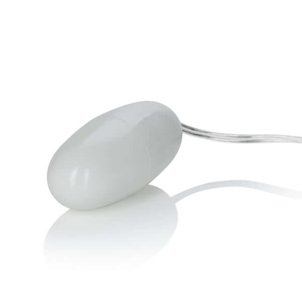 Sleek ivory bullet vibrator with multi-speed capabilities by California Exotic Novelties for targeted stimulation.