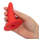 She-ology Silicone Wearable Vaginal Dilator 5 Per Set in red held in a hand for comfort and ease of use.