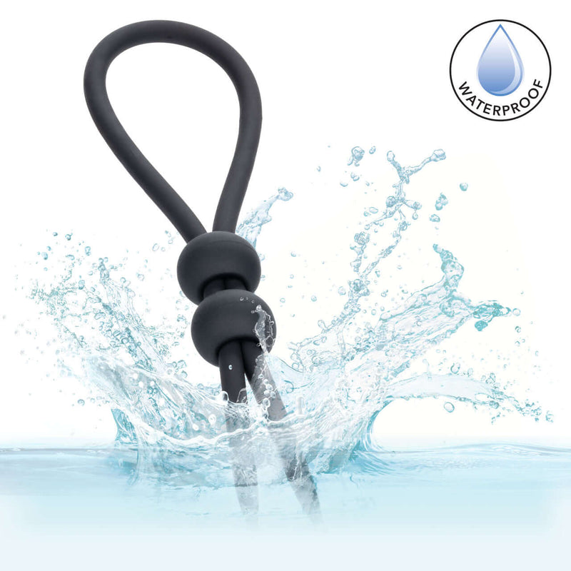 Alpha Liquid Silicone Dual Lasso Black in water, showcasing its waterproof design and premium adjustable features.