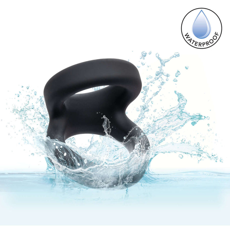 Alpha Liquid Silicone Snug Tugger Black splashing in water, showcasing its waterproof design and premium silicone material.