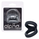 Alpha Liquid Silicone Snug Tugger Black in packaging next to the product designed for enhanced stamina and pleasure.