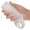 Hand holding Performance Maxx liquid silicone reversible sleeve with textured design and scrotum support.