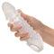 Hand holding Performance Maxx Liquid Silicone Adonis enhancer for added length and girth.