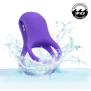 Basic Essentials Vibrating Dual Support Cock Ring Purple submerged in water, showcasing its waterproof IPX7 feature.