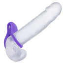 Basic Essentials Vibrating Dual Support Cock Ring Purple on a clear dildo, designed for enhanced pleasure and comfort.