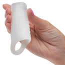 Basic Essentials Liquid Silicone Pleasure Enhancer Clear held in hand, showcasing its flexible design for enhanced comfort.
