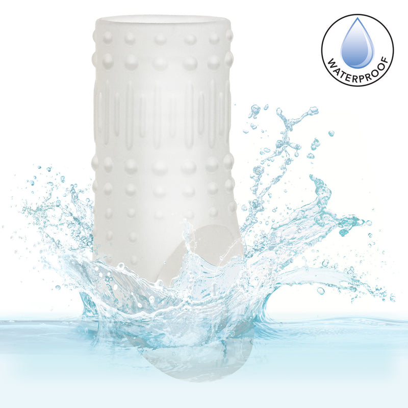 Basic Essentials Liquid Silicone Pleasure Enhancer Clear in water, showcasing its waterproof design and textured surface.