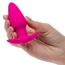 A hand holding the Basic Essentials Rechargeable Tapered Probe Pink, showcasing its sleek design and vibrant color.