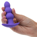Basic Essentials Rechargeable Beaded Probe Purple held in a hand, showcasing its smooth graduated beaded design.