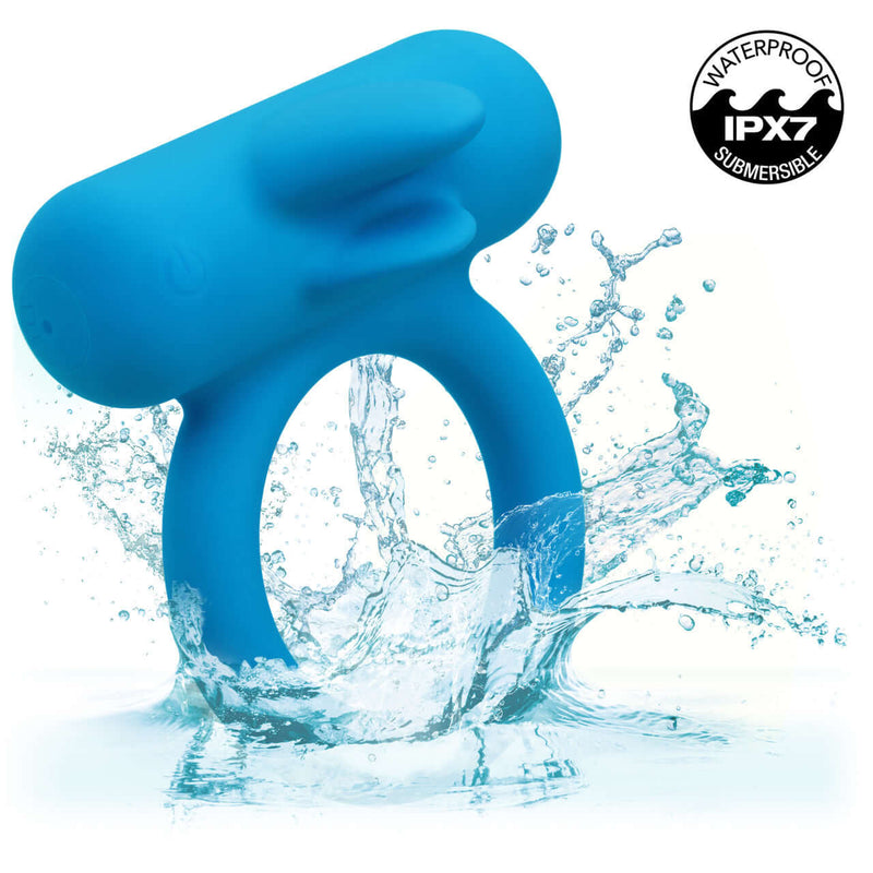Blue silicone couples vibrating enhancer with water splash, featuring the waterproof IPX7 symbol.