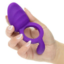 Closer Intimate Vibrating Cock Ring Passion Purple held in a hand, showcasing its textured design and comfortable fit.