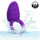 Closer Intimate Vibrating Cock Ring Passion Purple splashing in water, showcasing its waterproof design and dual motors.