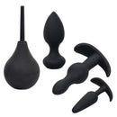 Pleasure Kits Anal Explorer Collection Black - 4-piece set including anal toys and cleansing accessory for exploration.